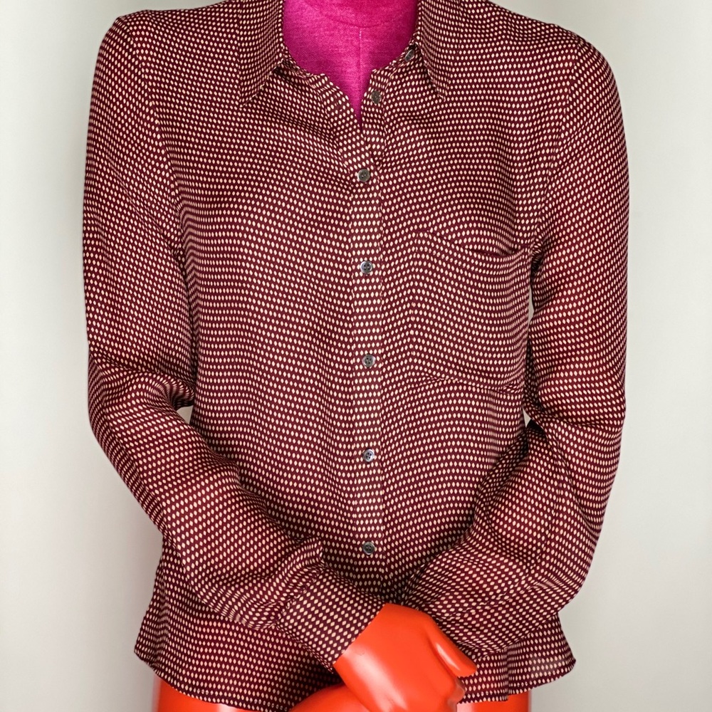 One pocket button down blouse.